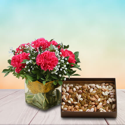 Pink Carnations In Glass Vase With Dry Fruits Pink Carnations In Glass Vase With Dry Fruits